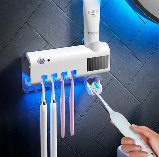 Esterilizador de cepillos con dispensador de crema dental.